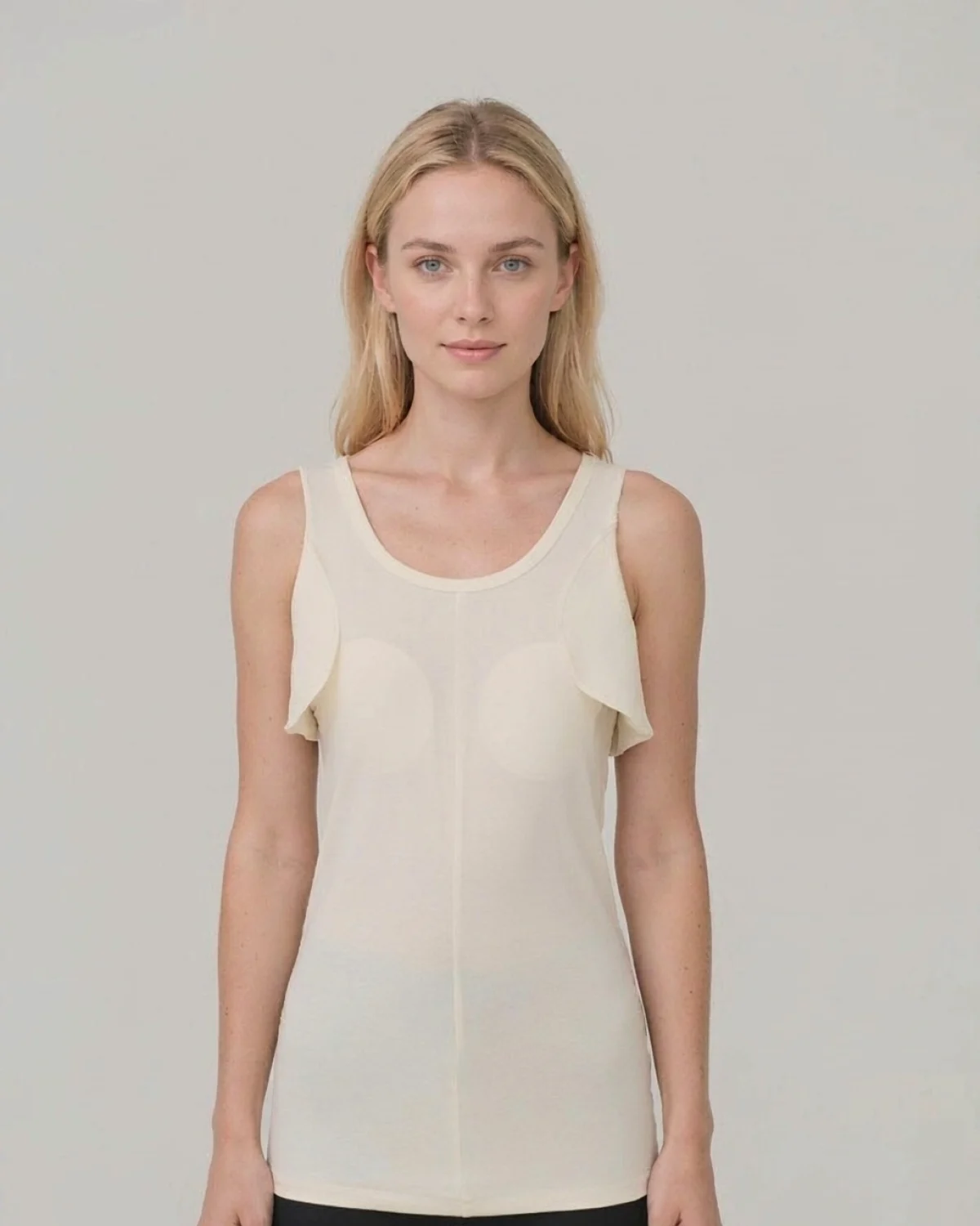Woman wearing a SpineShield knit liner with axilla flaps